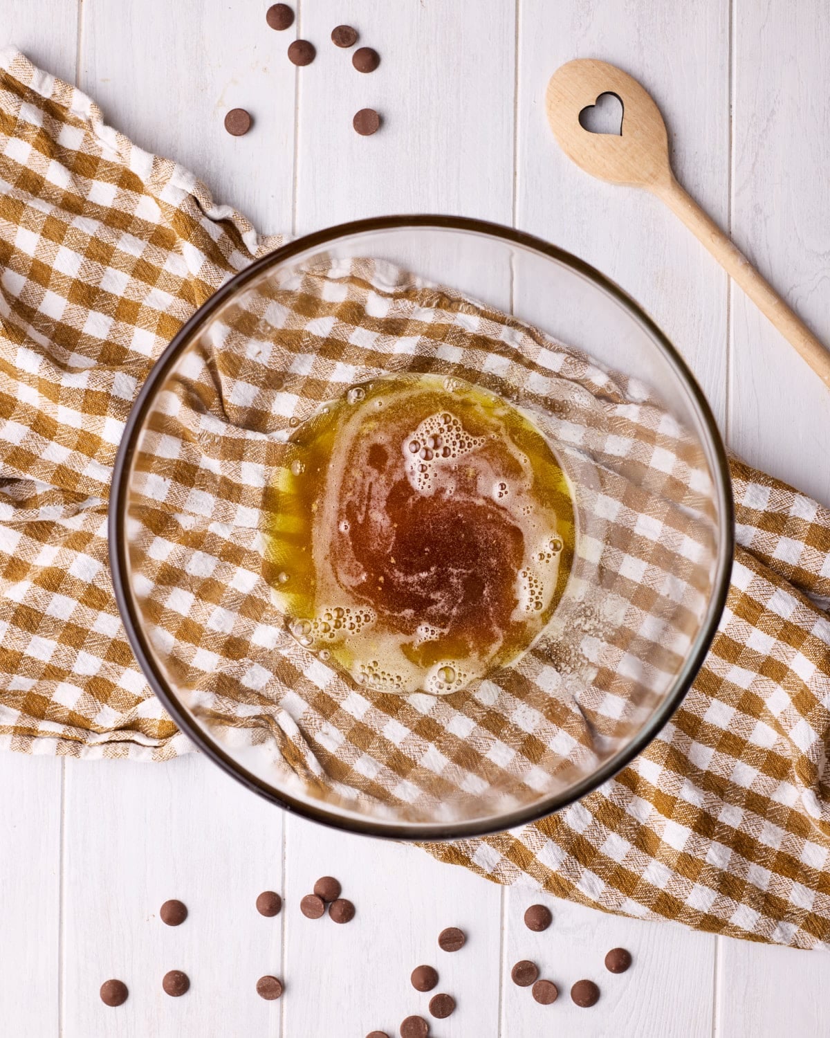 Browned butter cooling in a glass bowl.