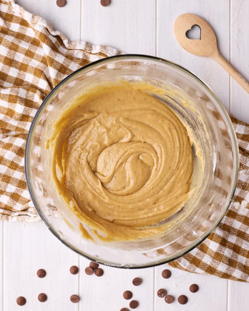 Brown butter chocolate chip cookie dough in a glass bowl. 