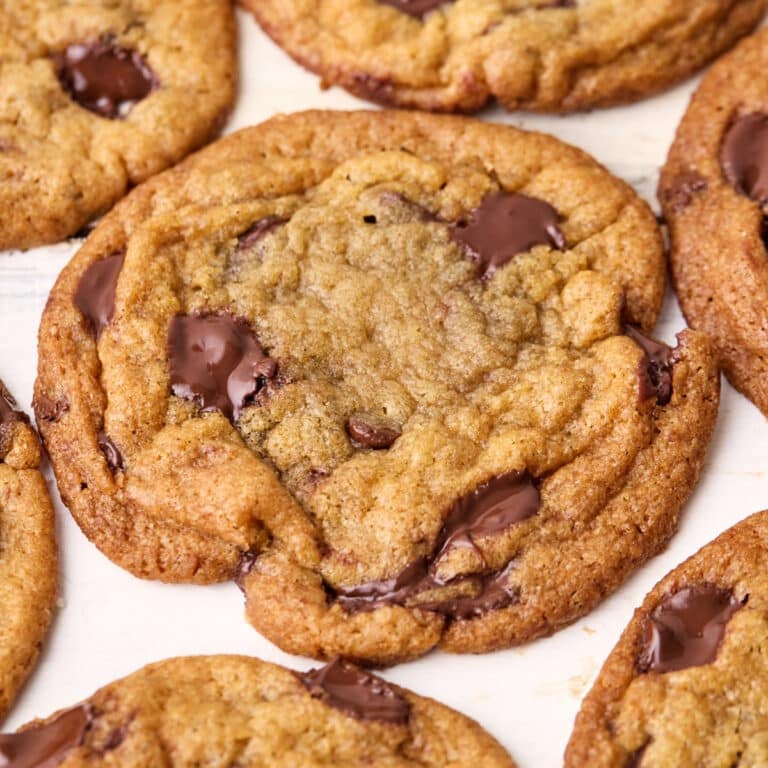Close up of brown butter chocolate chip cookies, the chocolate is still melty and shiny.
