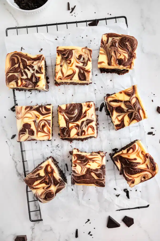 Cheesecake brownies being sliced.