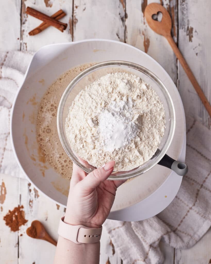 Mixing together dry ingredients to add to muffin batter for cinnamon swirl muffins.