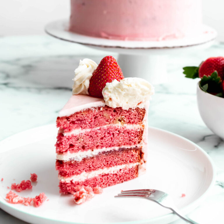 slice of strawberry cake with beautiful pink layers.