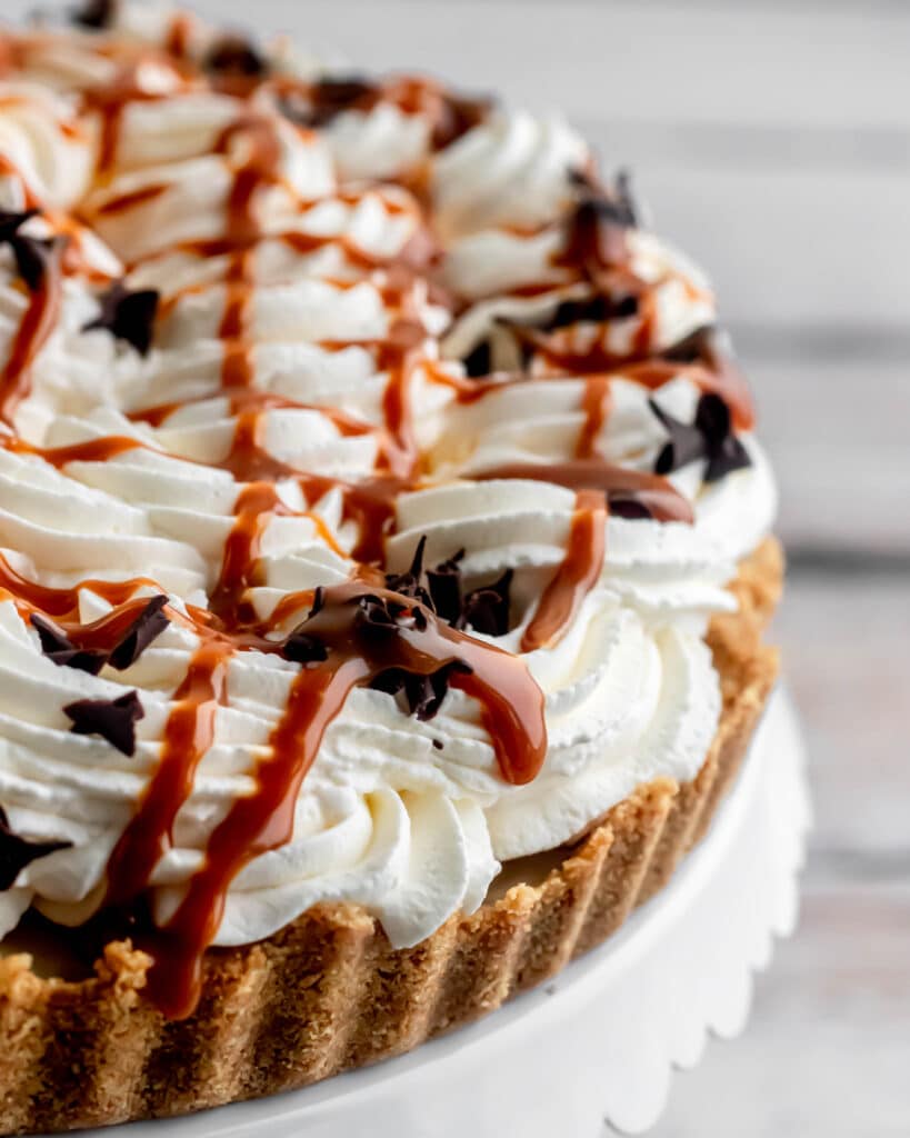 Whole banoffee pie with caramel drizzled on top