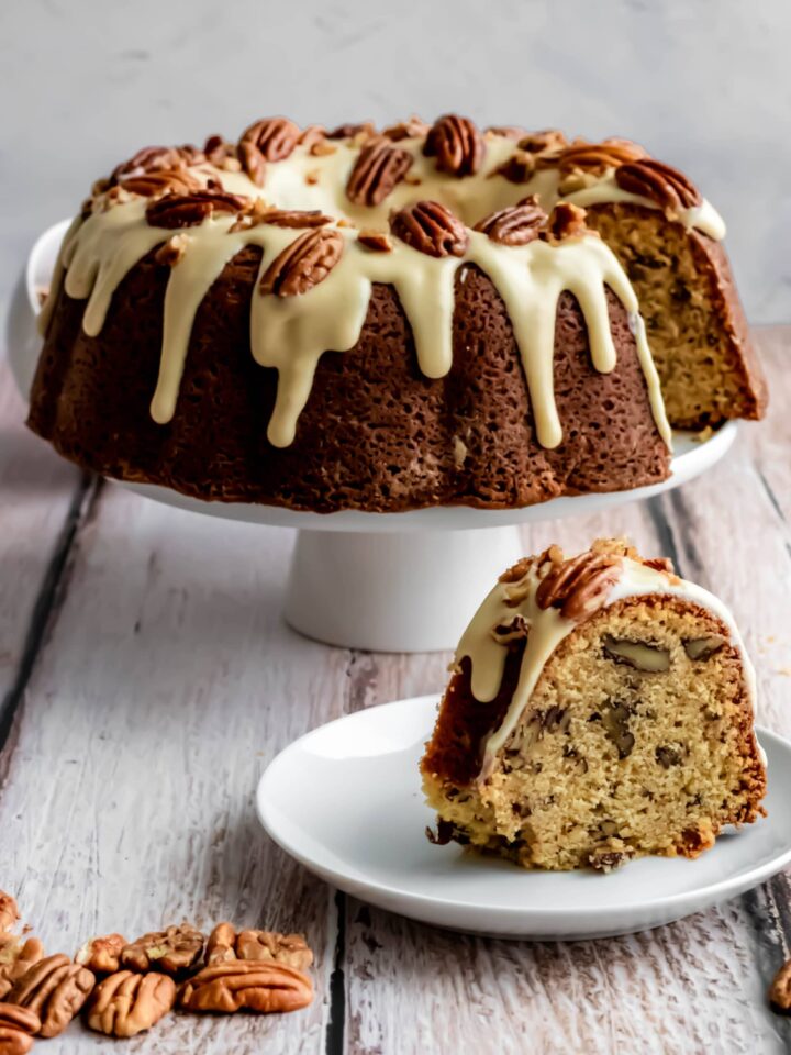 maple pecan bundt cake with cream cheese glaze and candied pecans