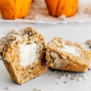 Cheesecake stuffed carrot muffins cut in half.
