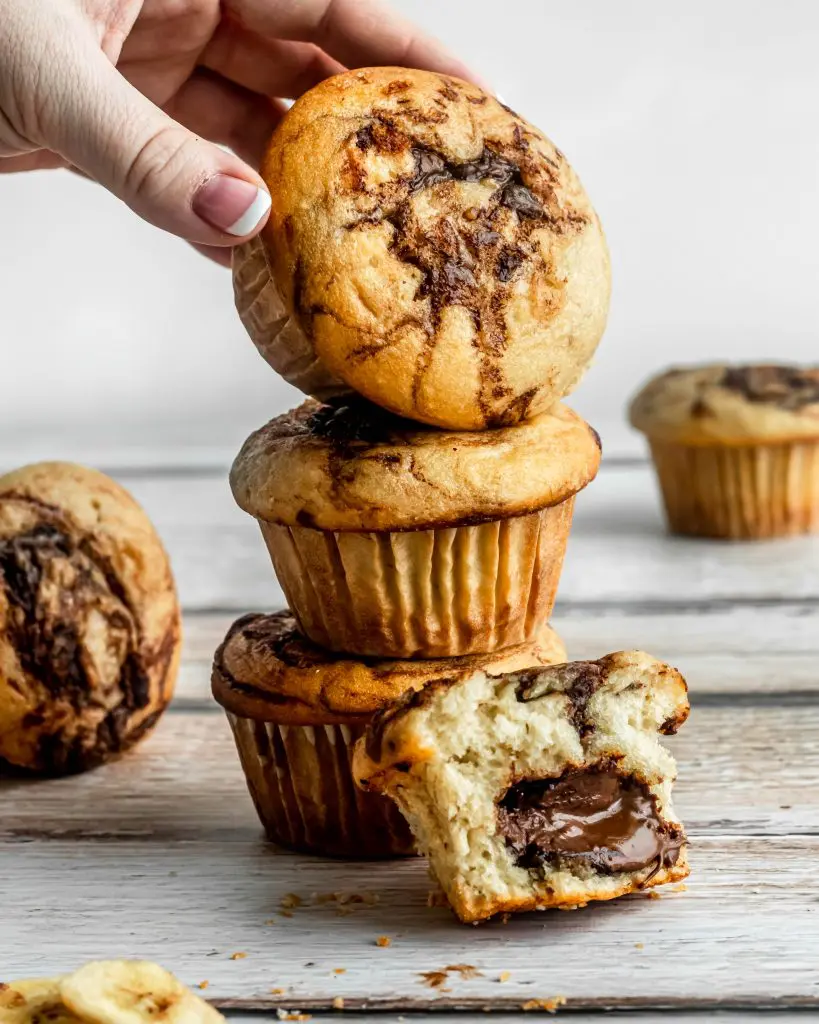 Nutella stuffed Banana Muffins stacked on top of each other