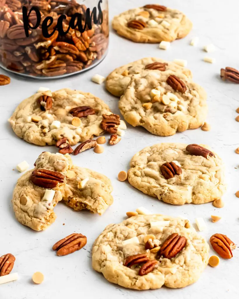 white chocolate pecan and butterscotch cookies on a table 