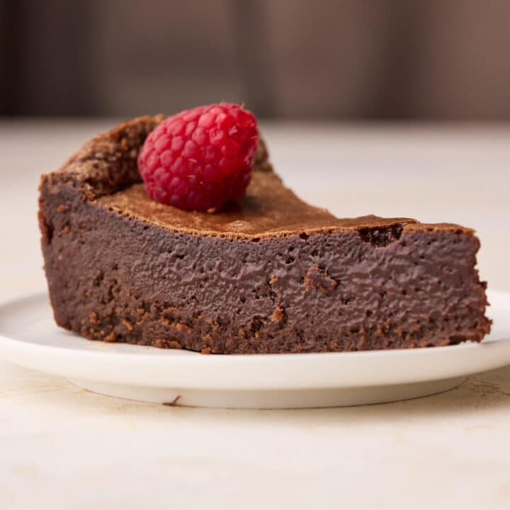 Slice of chocolate torte from the side to show the custard-like texture inside.