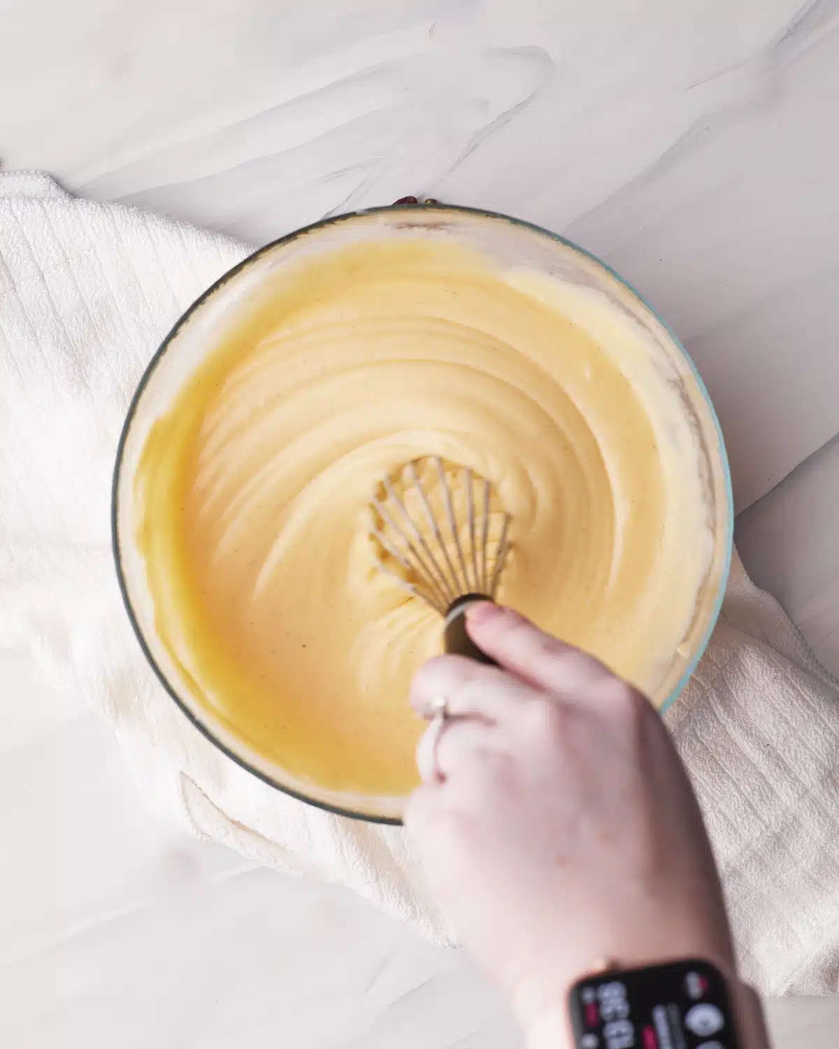 Finished creme patissier/ pastry cream/ custard being whisked to show thick and glossy. 