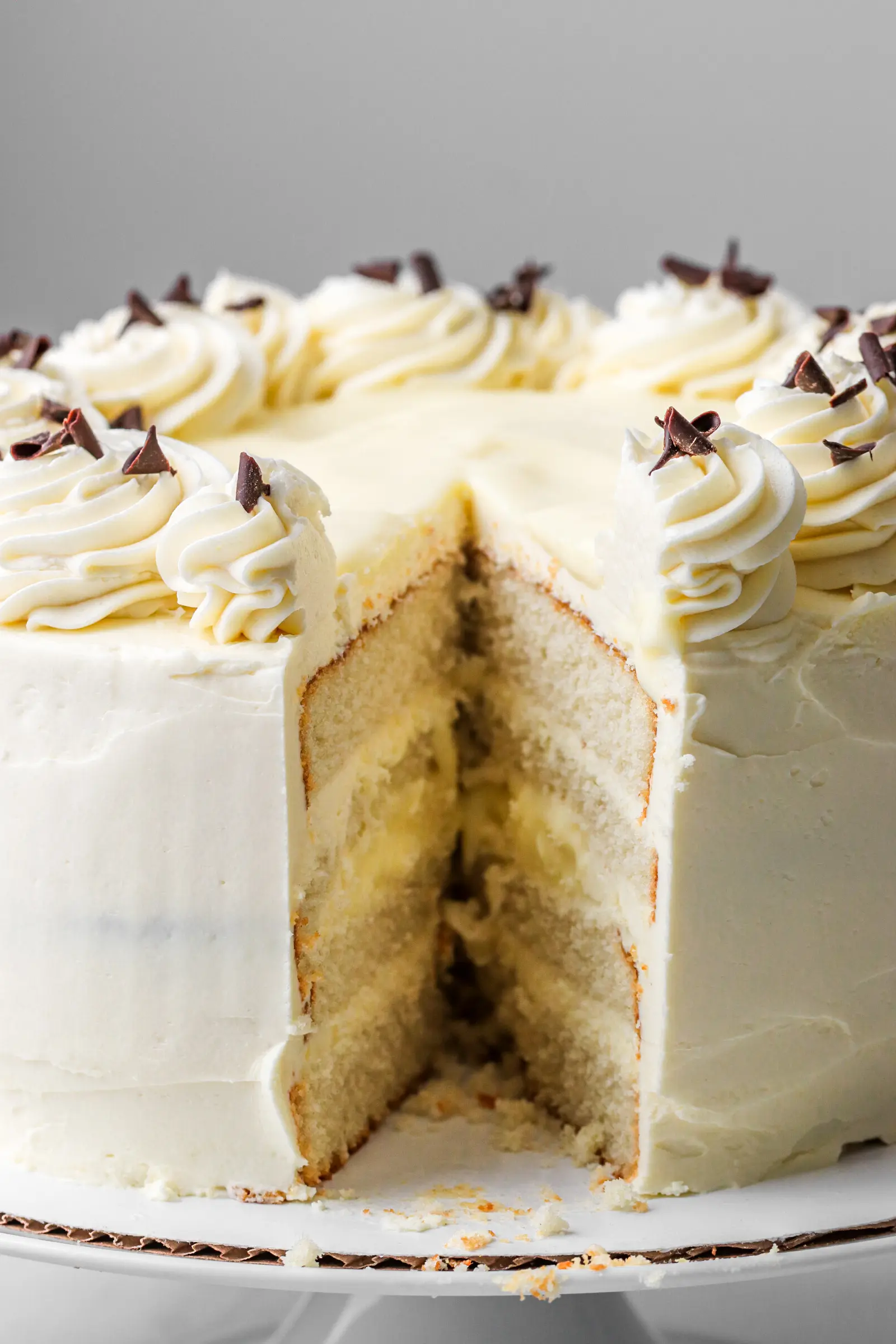 Custard cake with a slice cut out of it.