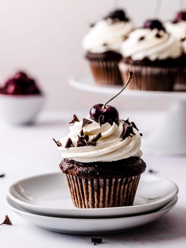 black forest cupcakes with fresh cherries on top