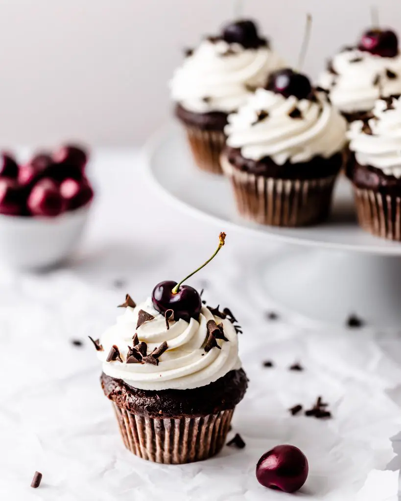 black forest cupcakes with bowl of fresh cherries