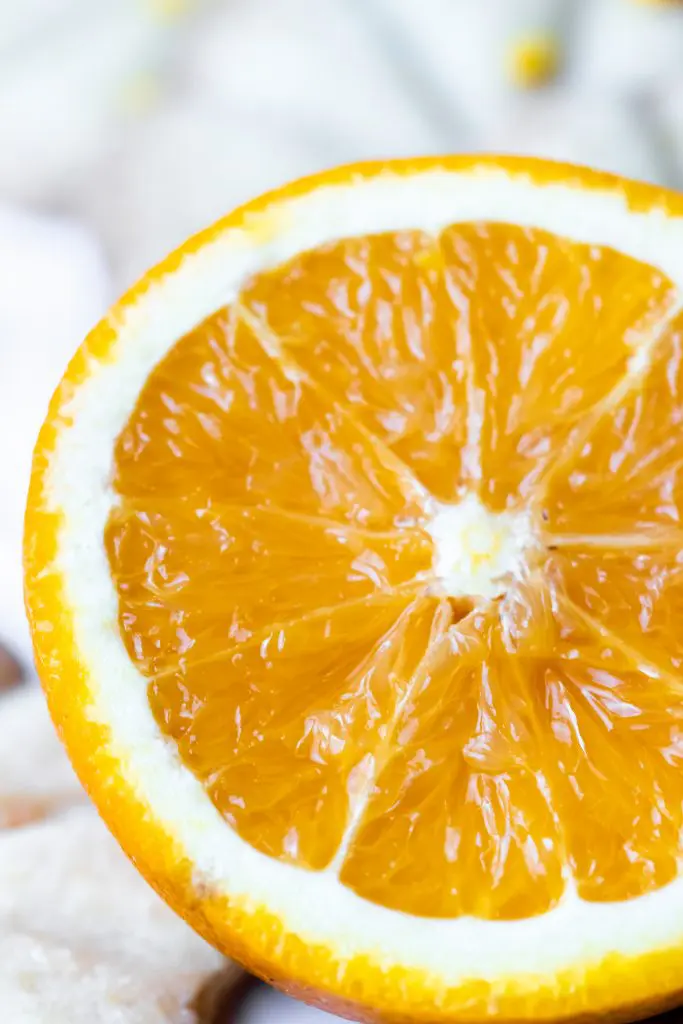 close up of fresh orange, sliced in half