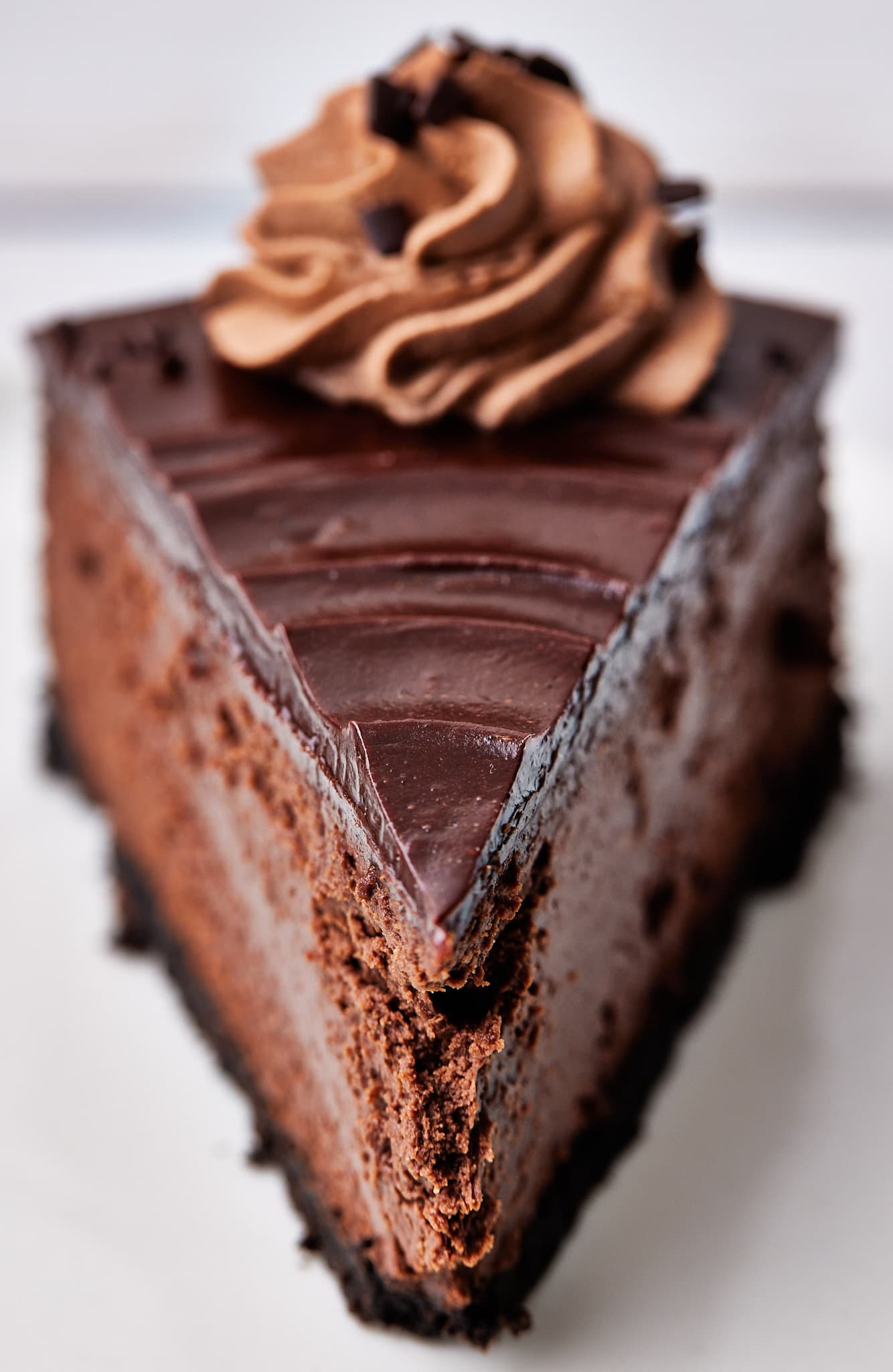close up slice of cake from the front with ganache swirl