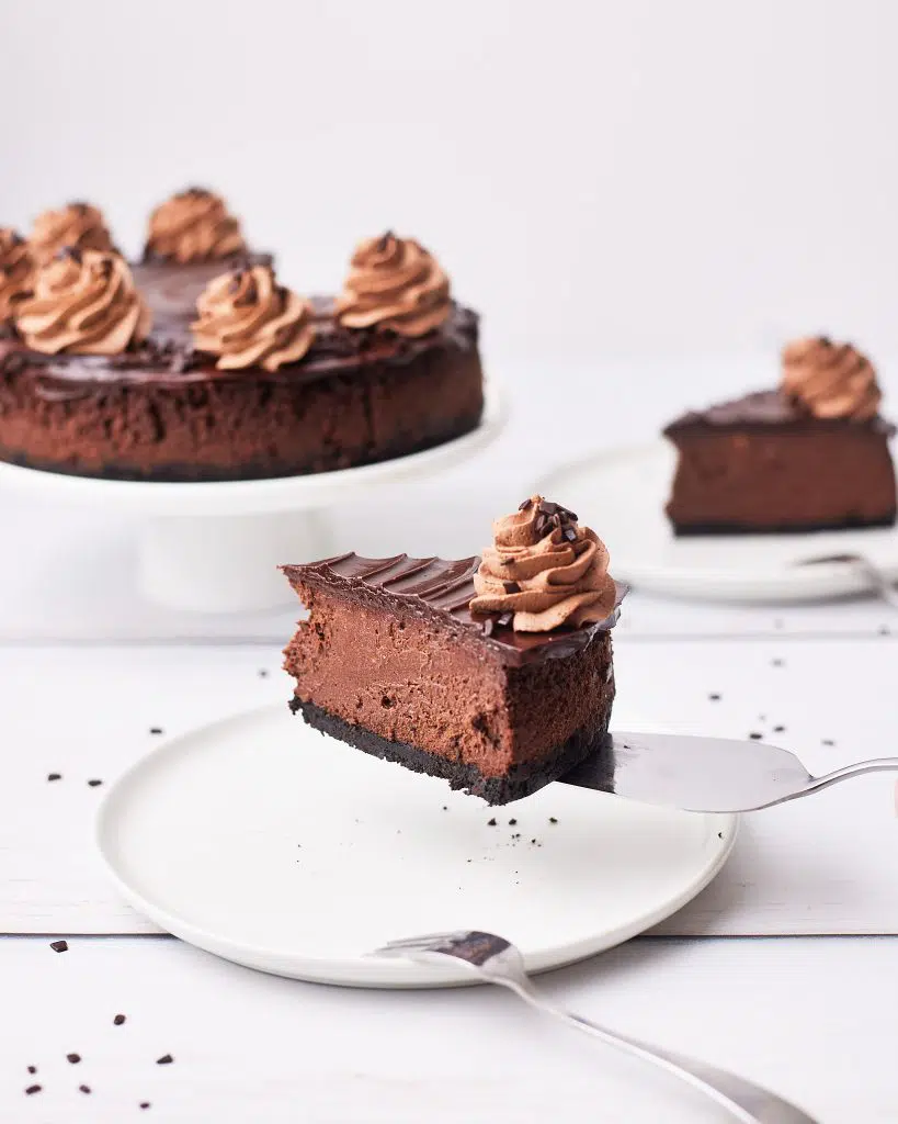 table set with multiple slices of cake