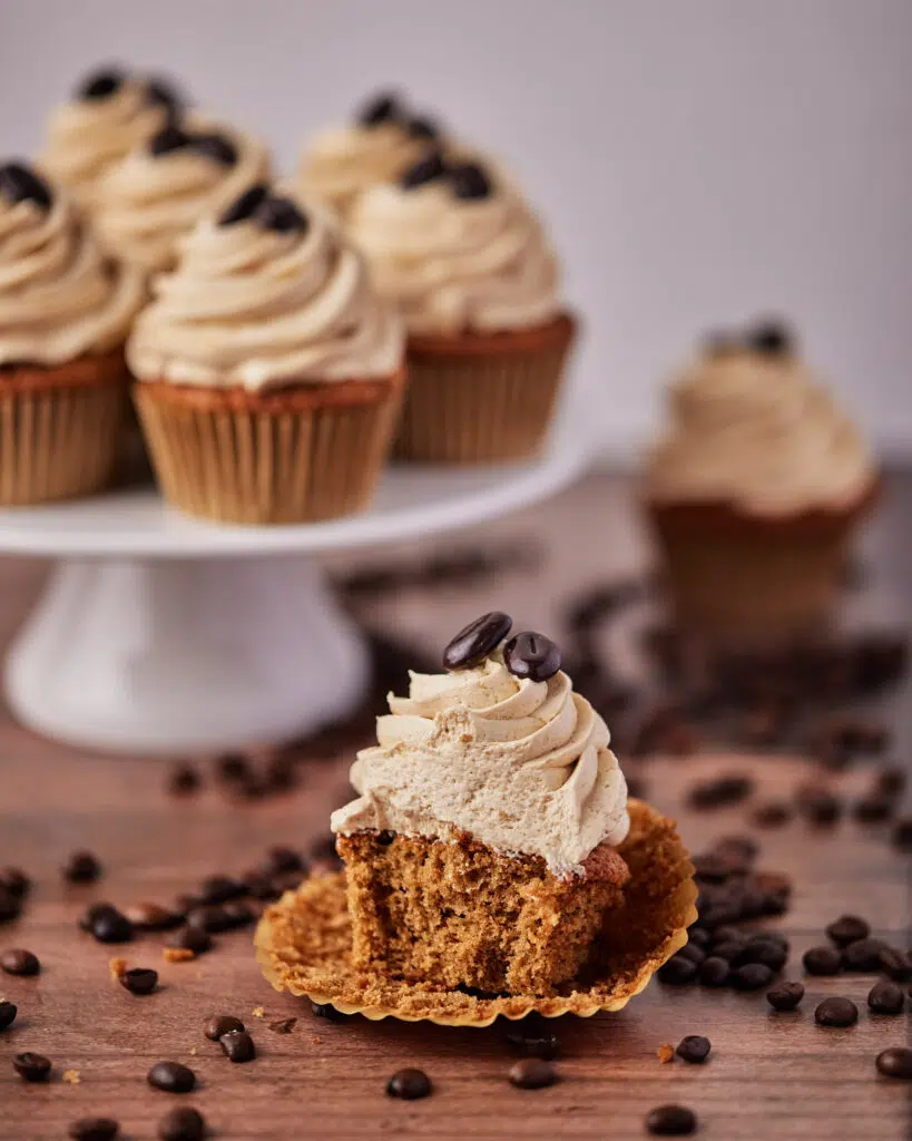 coffee cupcake with a bite taken out of it. 