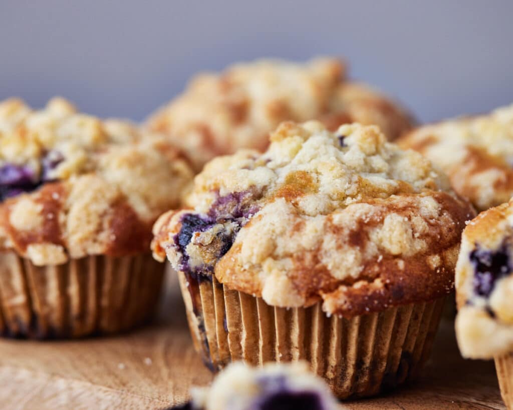 blueberry cream cheese muffins with crunchy crumble topping