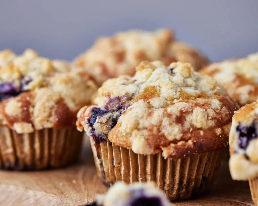 blueberry cream cheese muffins with crunchy crumble topping