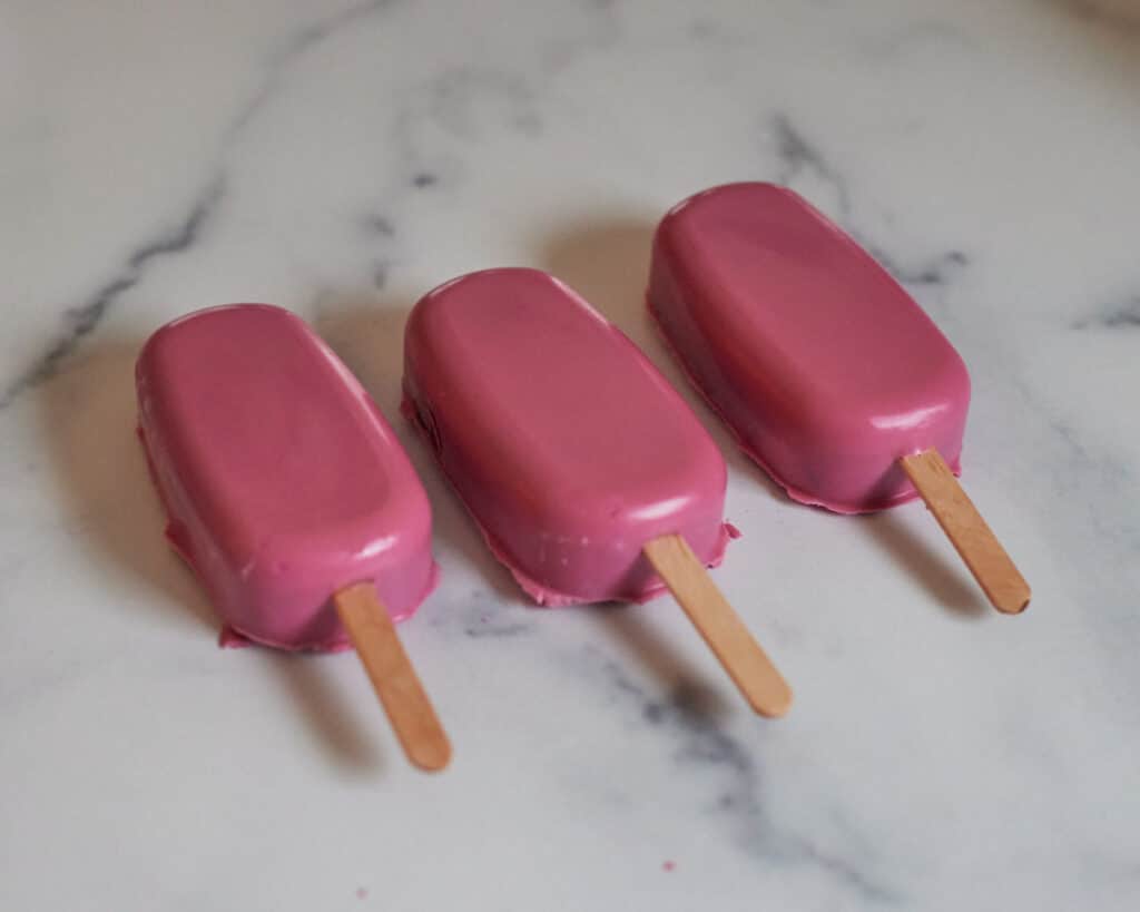 unmolded cakesicles with pink candy melts