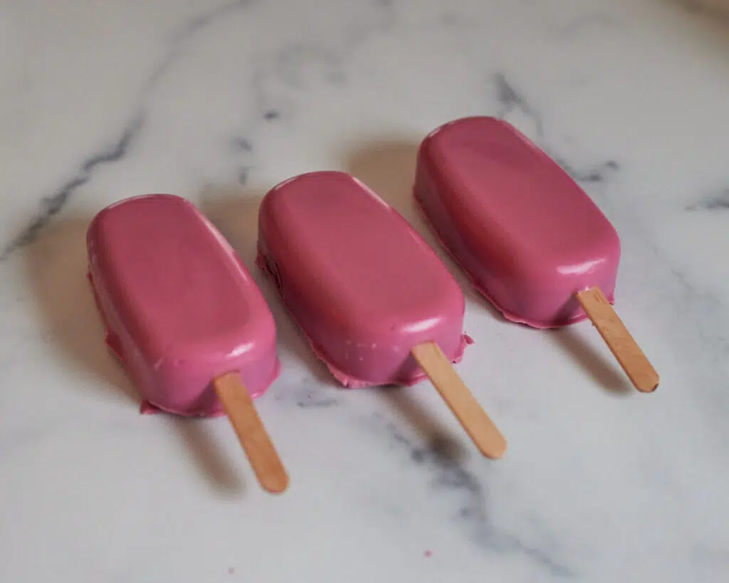 unmolded cakesicles with pink candy melts