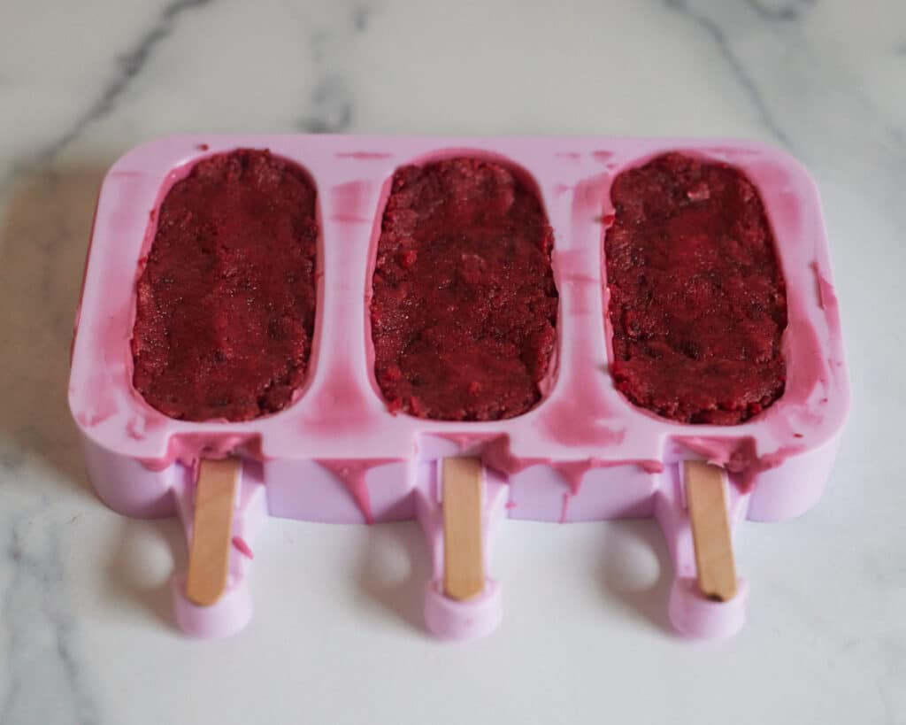 cakesicle mold filled with red velvet cakesicle mix