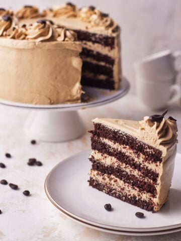 chocolate espresso cake with slice cut out of it.