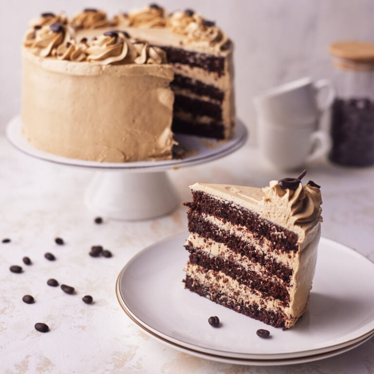 chocolate espresso cake with slice cut out of it.