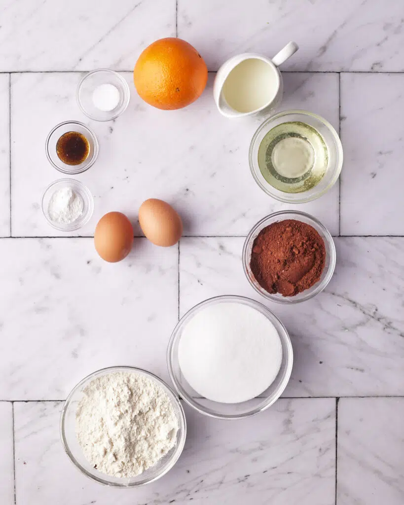 flatlay of ingredients of baking chocolate orange cake