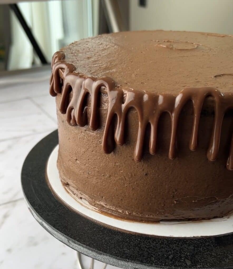 chocolate ganache drip on the side of a layer cake.