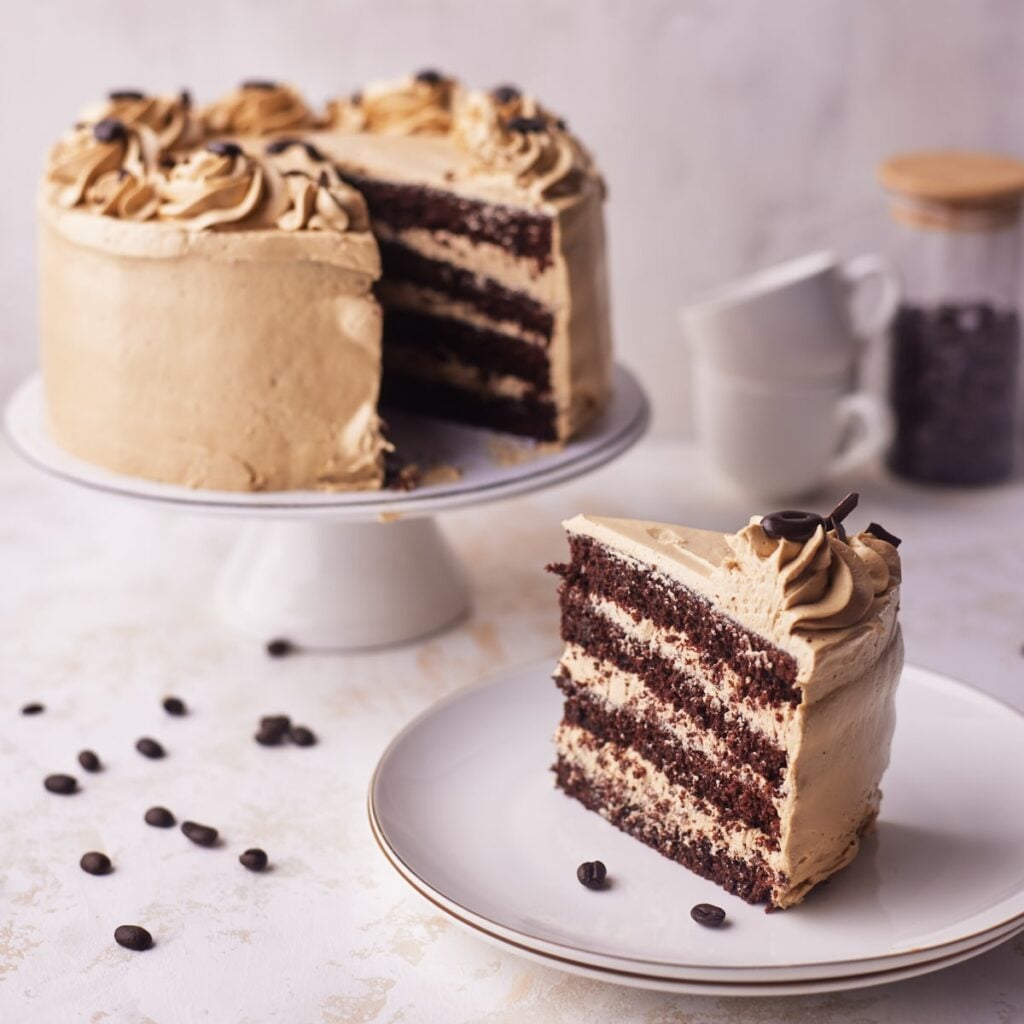 chocolate espresso cake with slice cut out of it.