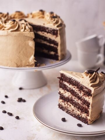 chocolate espresso cake with slice cut out of it.