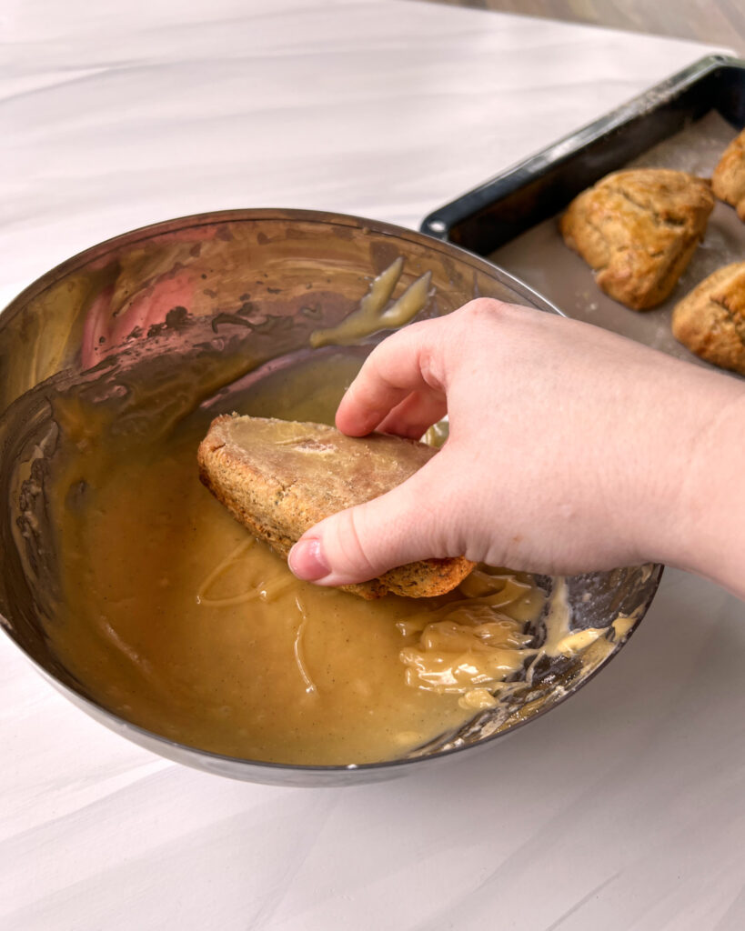 dipping scones into earl grey glaze.