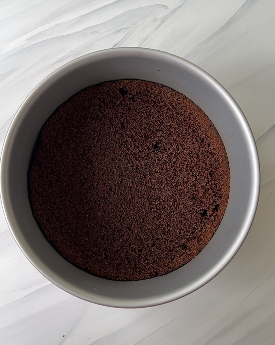 Base layer of black tie mousse cake - chocolate cake layer.