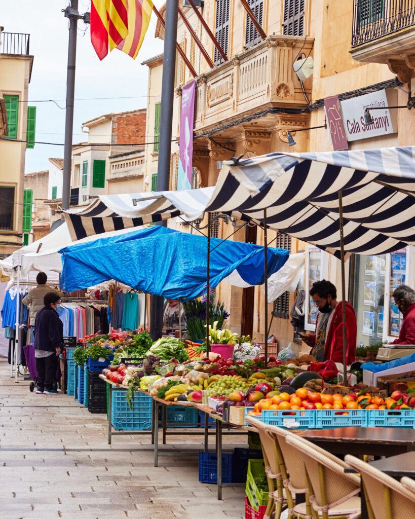streets of Santanyi with farmers market set up in mallorca.