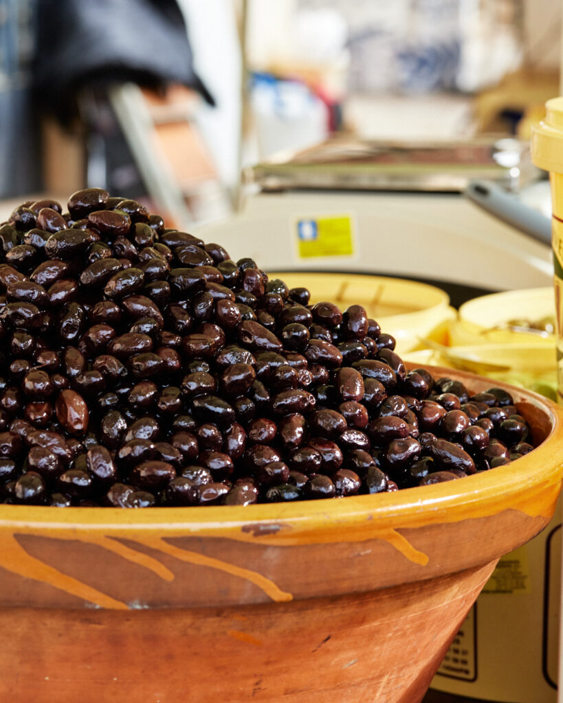 mound of spanish olives at food market in mallorca.