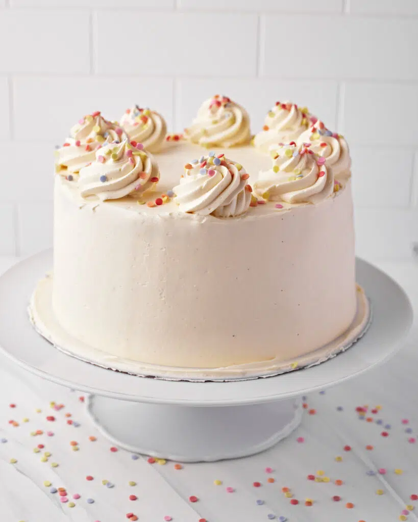 whole french vanilla cake with pastel sprinkles.