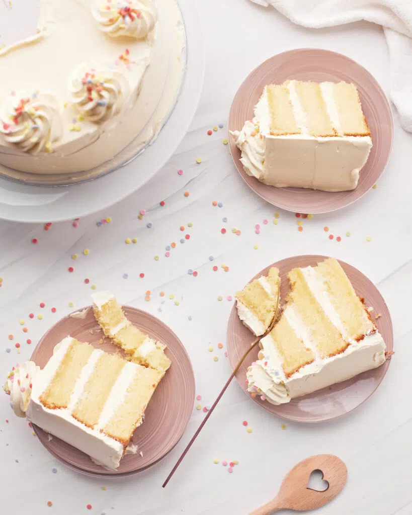 top down view of several slices of french vanilla cake on plates.