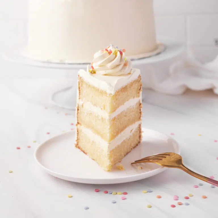 Single slice of french vanilla cake pointing towards the camera.