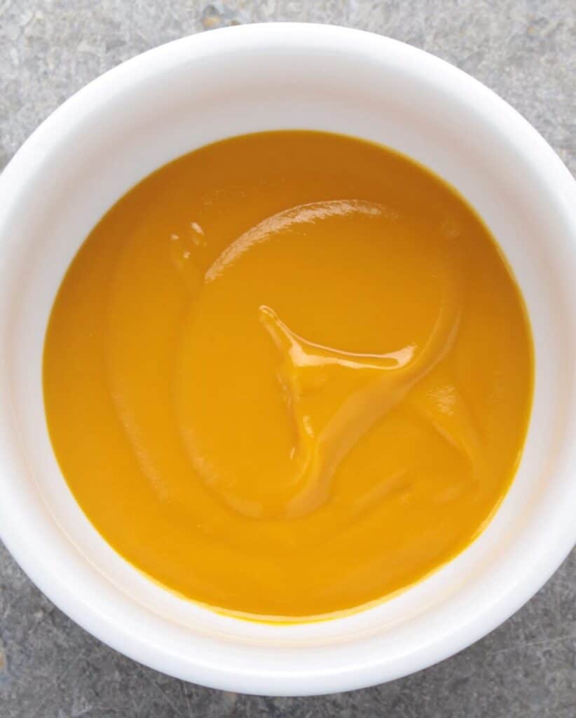 smooth mango coulis in a bowl.