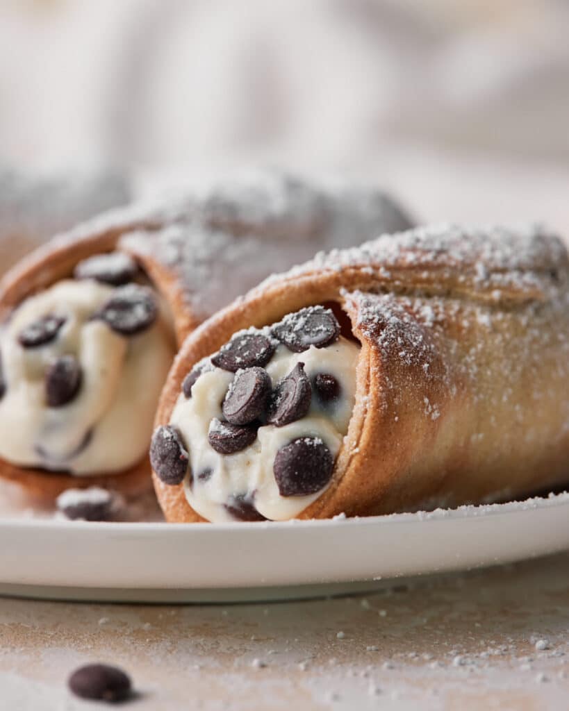 close up of air fryer cannoli with chocolate chips.
