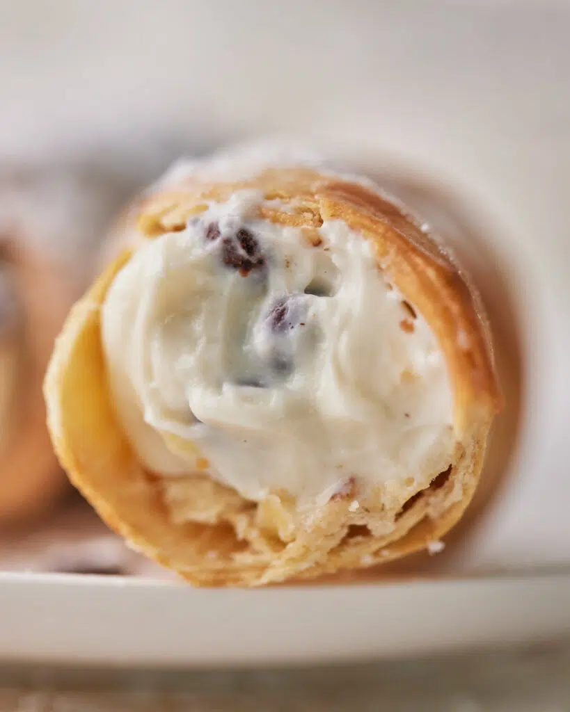 Close up of cannoli filling in air fryer shell.