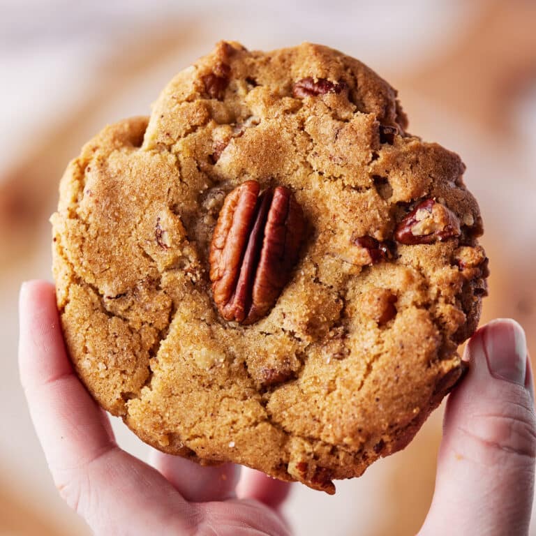 Close up of a brown butter pecan cookie.