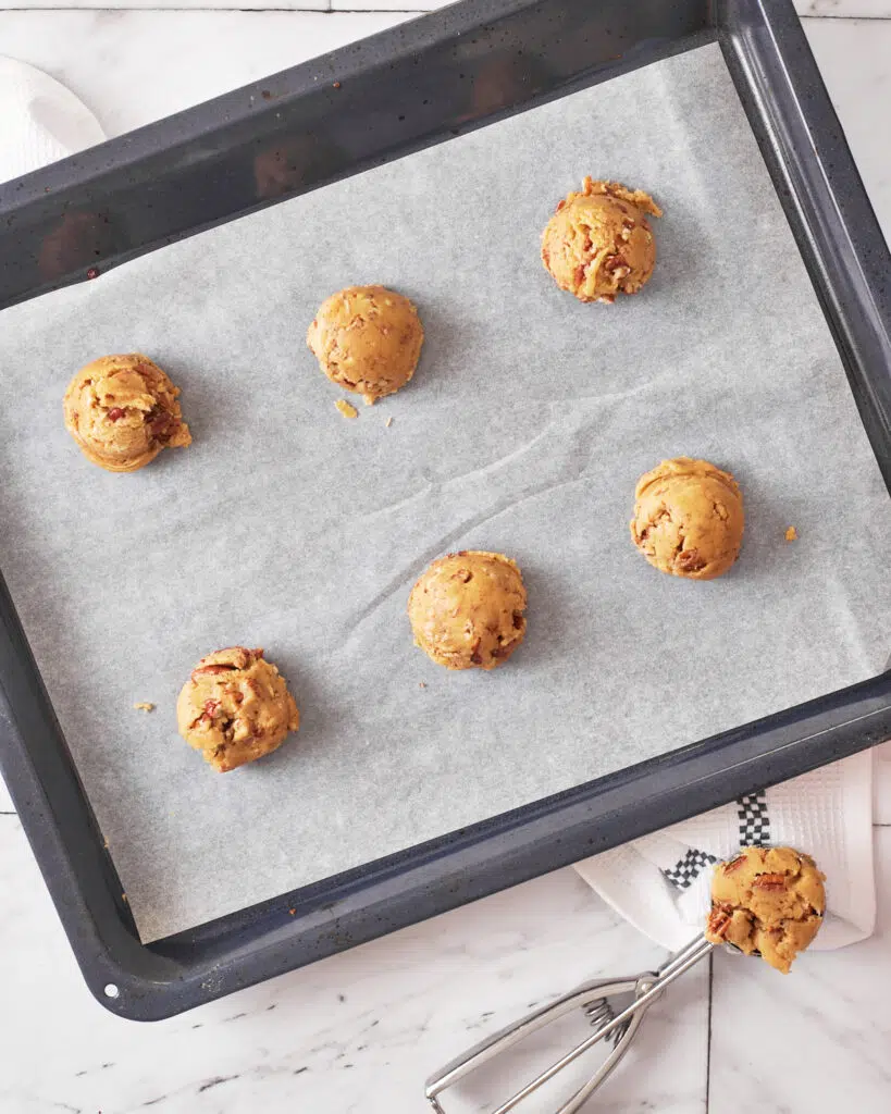 round balls of brown butter pecan cookie dough ready for baking.
