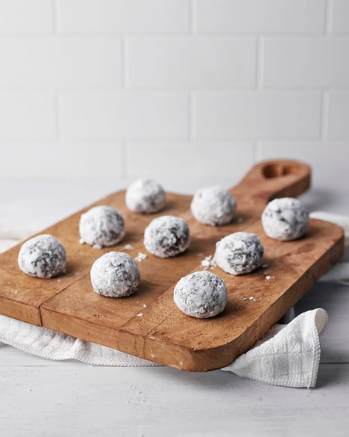 chocolate balls on a wooden platter (scottish truffles).