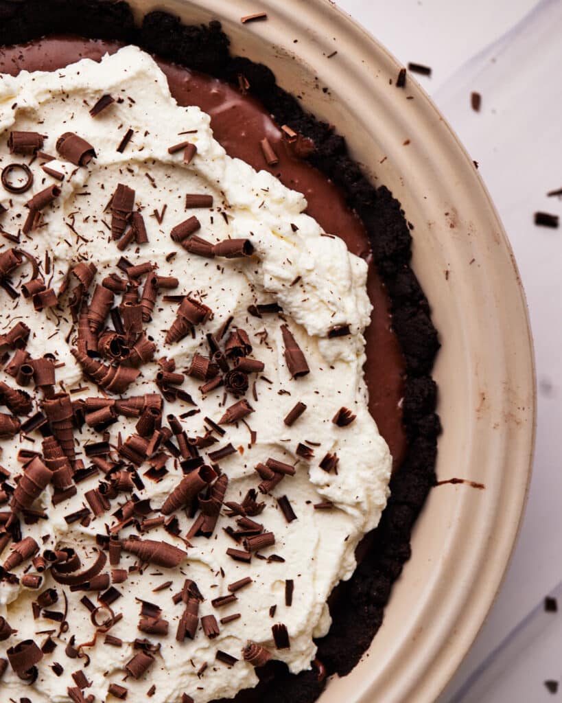 top down view of french silk pie with chocolate curls. 