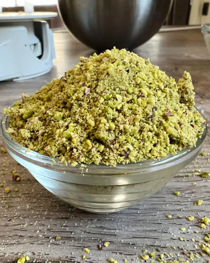 Ground pistachios to make pistachio crumble topping.