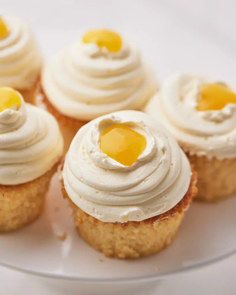 top down view of mango cupcakes with mango coulis.
