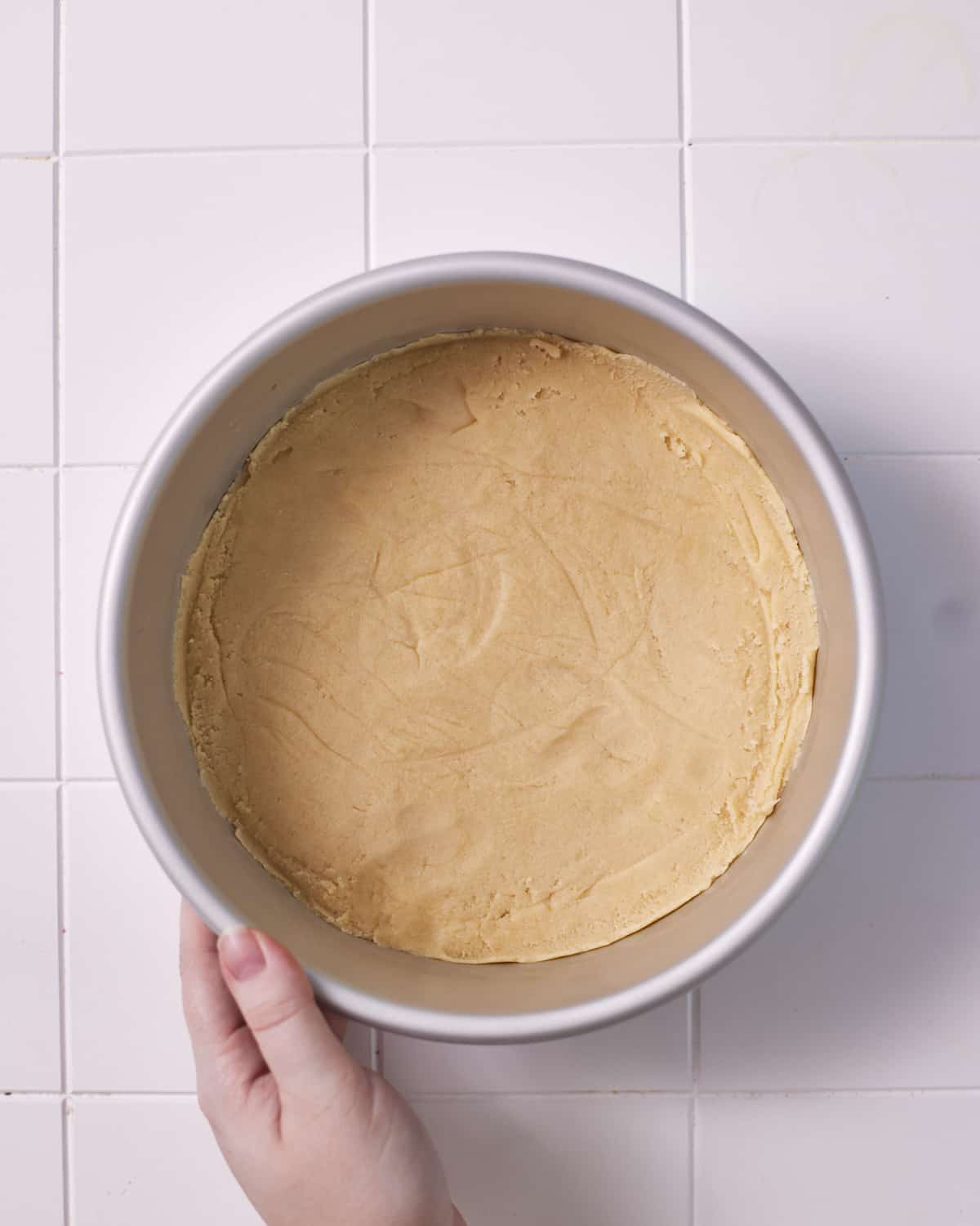 Process shot of making millionaires cheesecake shortbread base. 