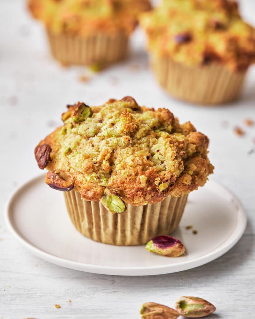 crunchy domed muffin top of pistachio muffin.