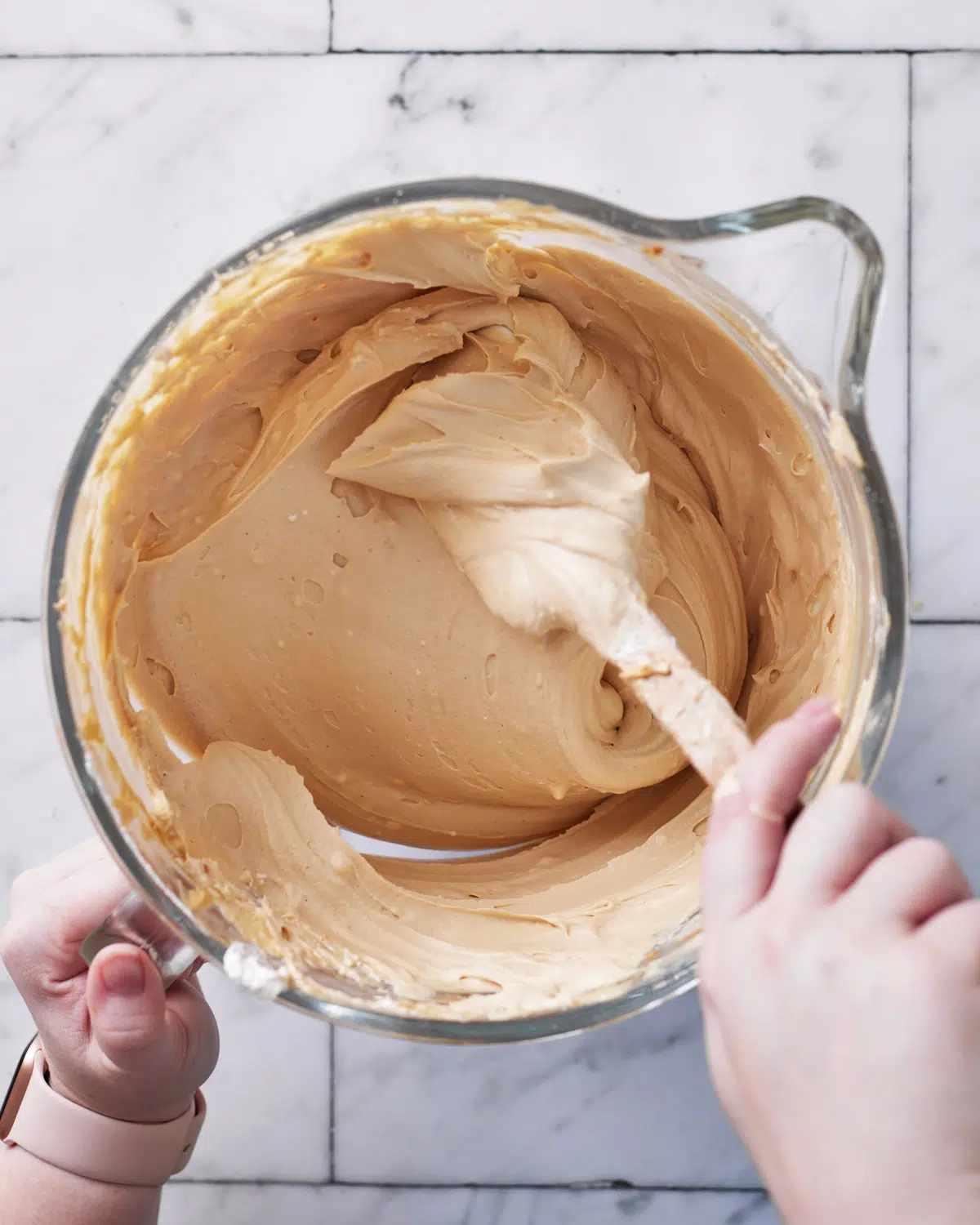 folding cream into cheesecake batter for biscoff cheesecake.